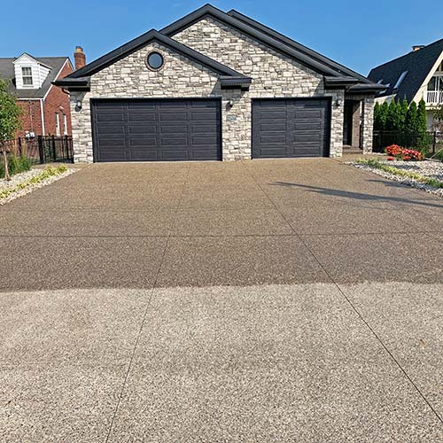 Restoring life to an exposed aggregate driveway in Macomb County, Michigan