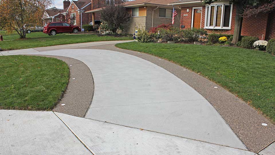 Exposed Aggregate Driveway Ribbons with Inset Lights in Huntington Woods, Michigan